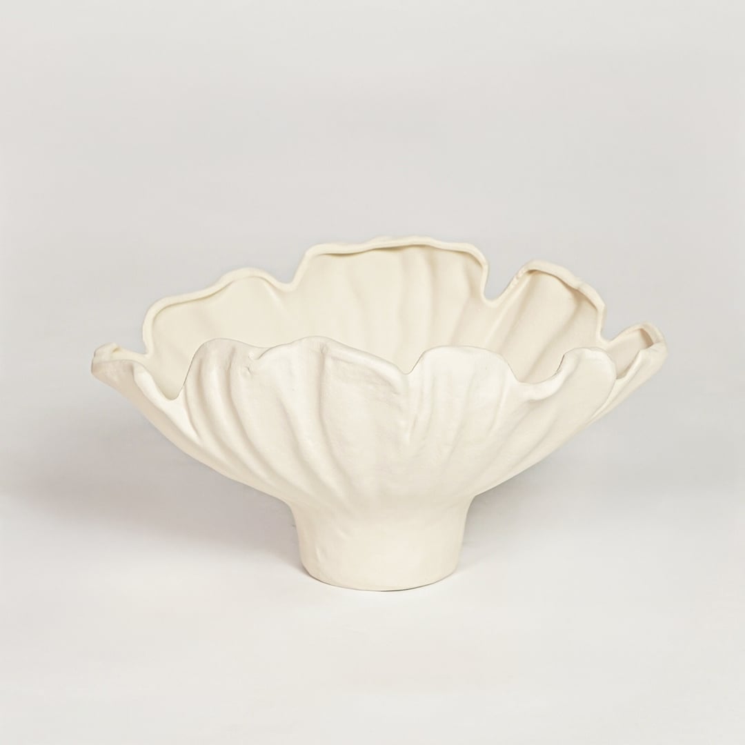 White ceramic floral decorative bowl with soft petal shape isolated on clean white background for contemporary interior decor use.