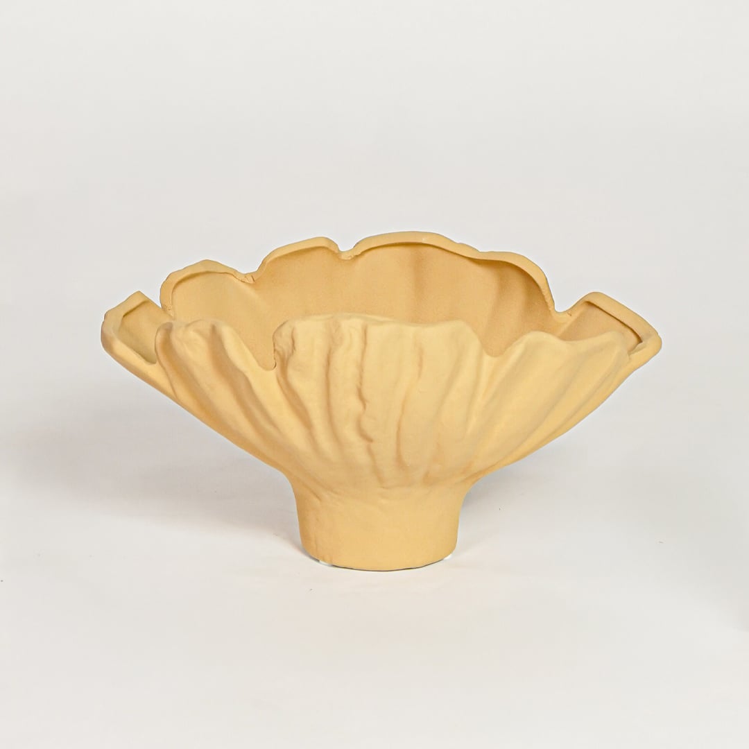 Yellow sagaform ceramic decorative bowl with fluted edges isolated on clean white background for modern decor styling.