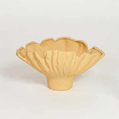 Yellow sagaform ceramic decorative bowl with fluted edges isolated on clean white background for modern decor styling.