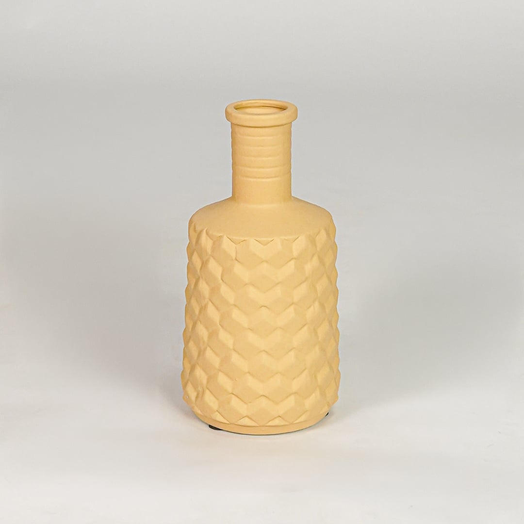 Yellow ceramic modern decorative flower vase isolated on clean white background stylish home decor vase for table shelf and console use.