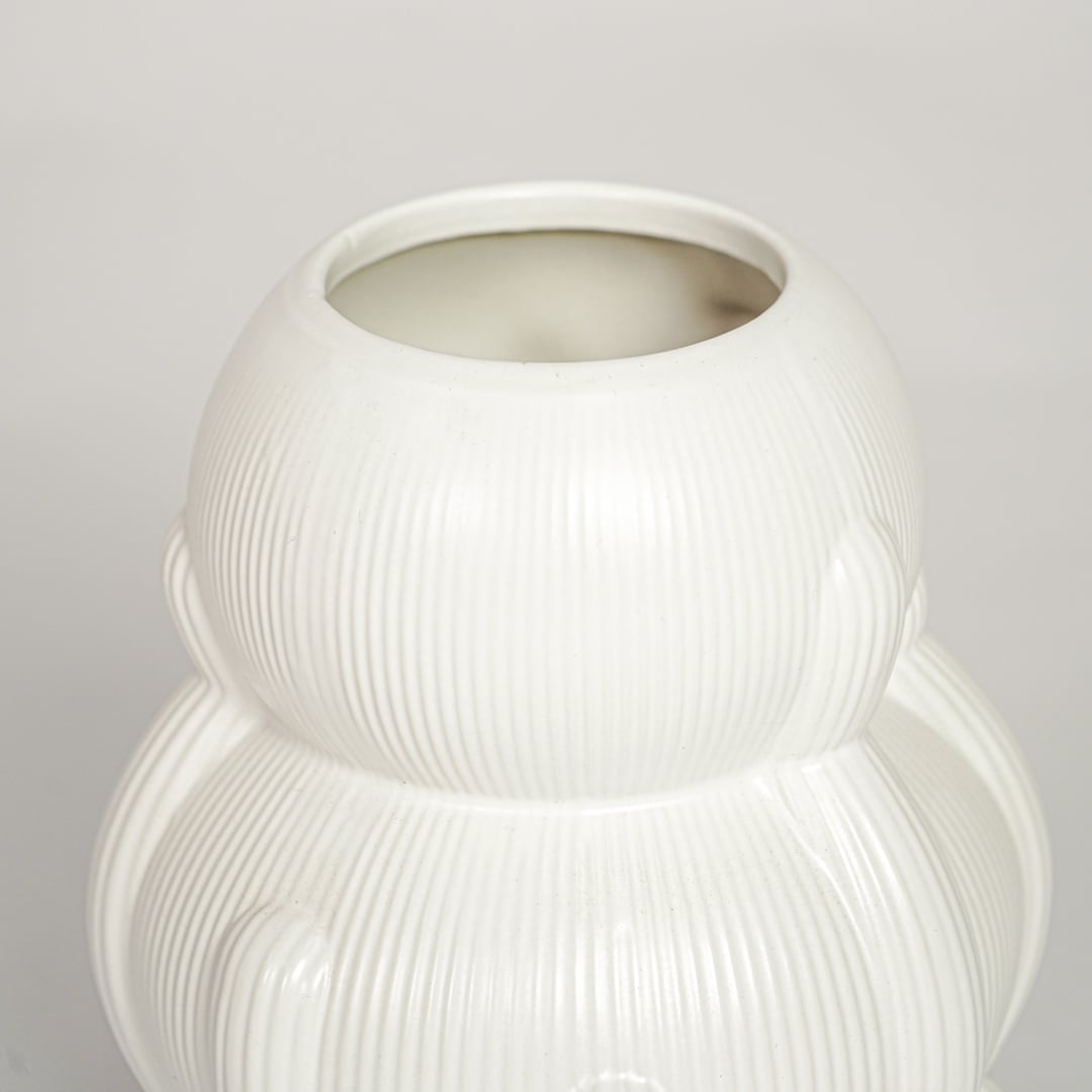 Contemporary white ceramic flower vase with artistic stacked silhouette perfect for entryway table living room decor display.