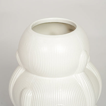 Contemporary white ceramic flower vase with artistic stacked silhouette perfect for entryway table living room decor display.