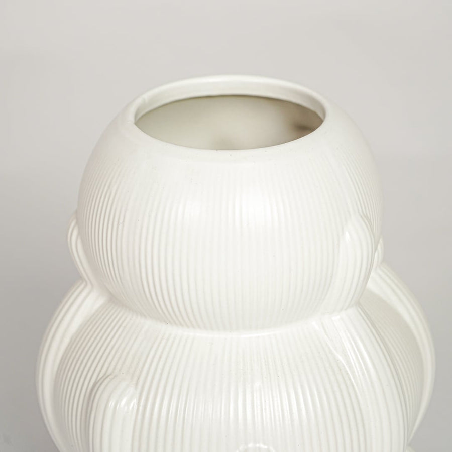 Contemporary white ceramic flower vase with artistic stacked silhouette perfect for entryway table living room decor display.