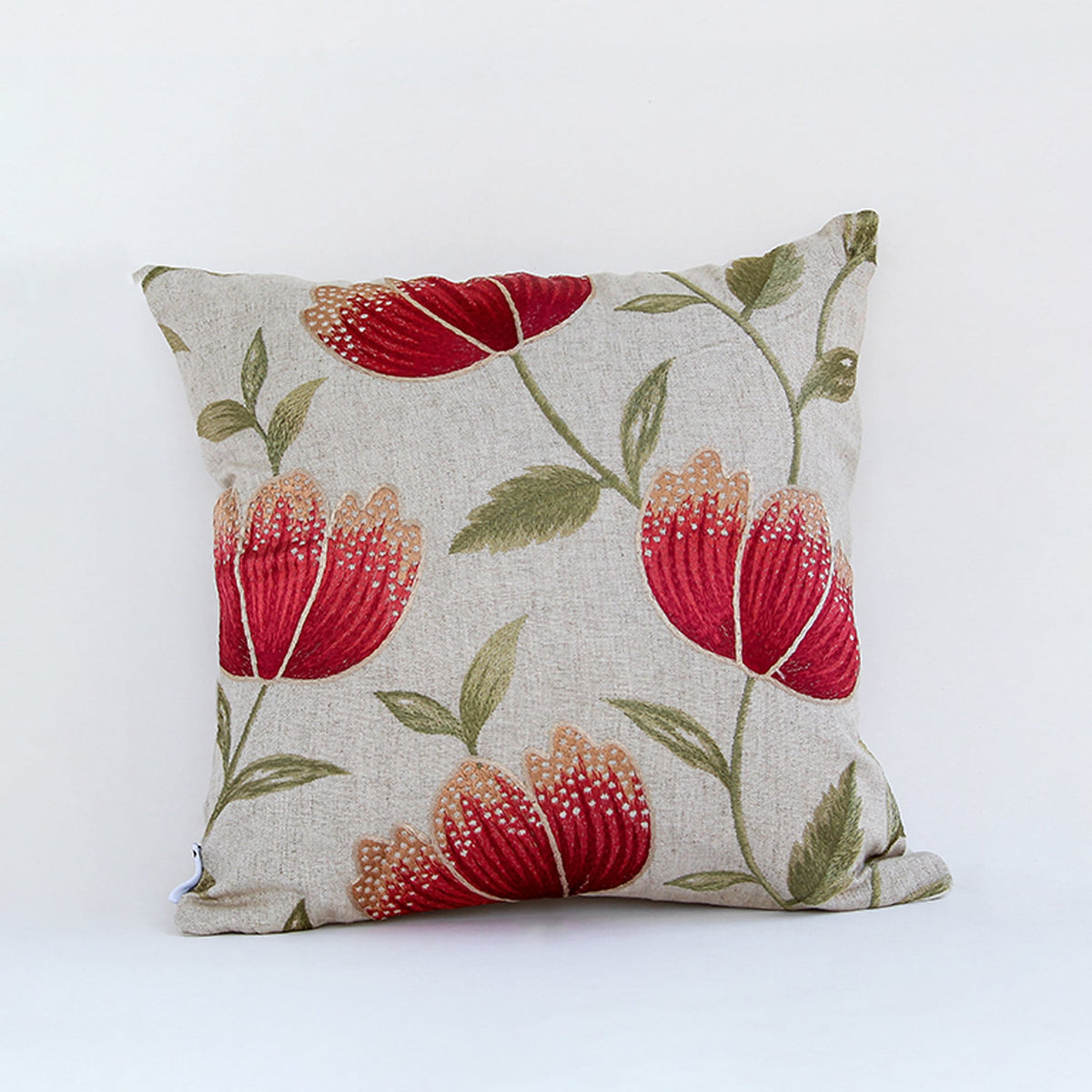 Beige cushion cover with red floral print on textured fabric designed for sofa chair and bed home decor styling.