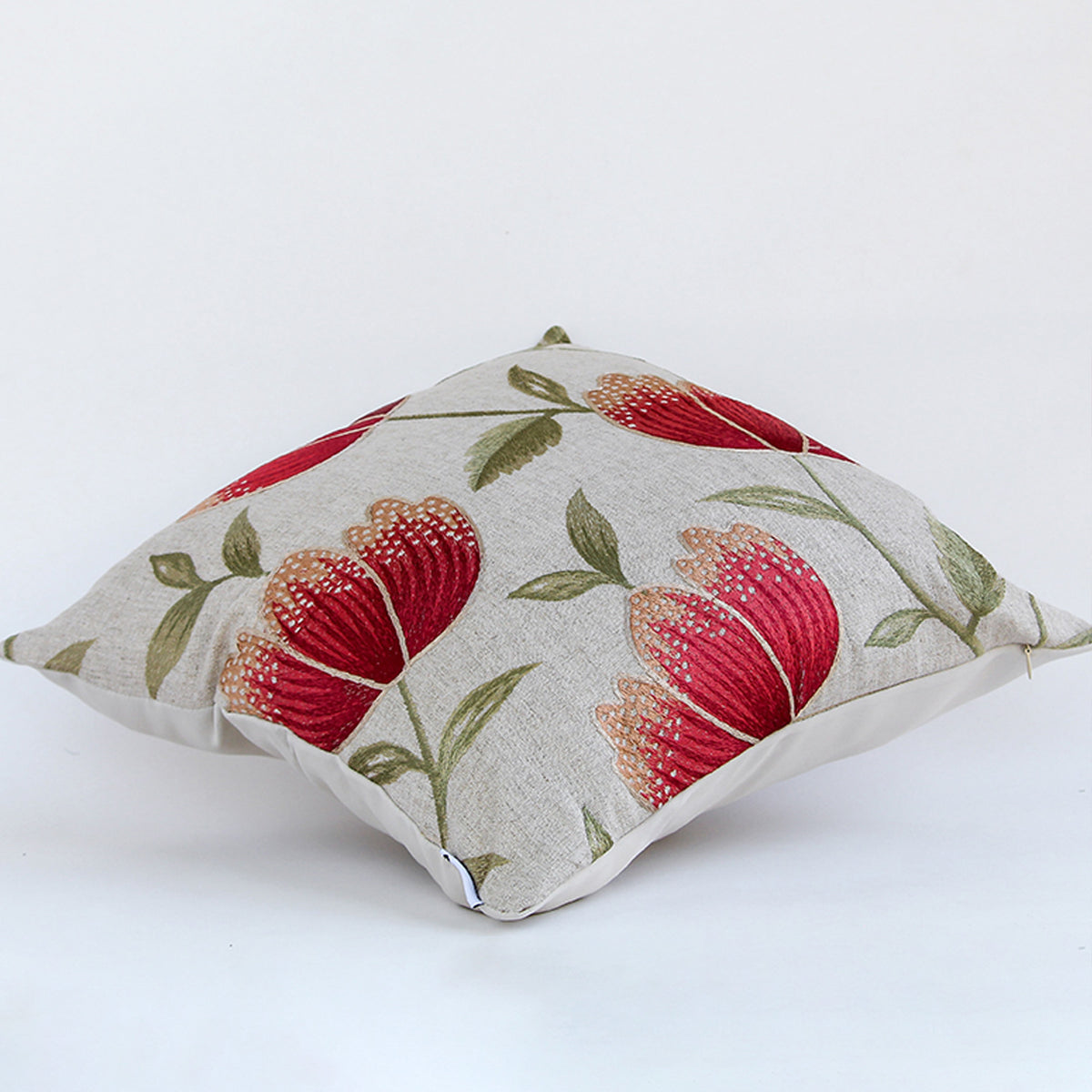 Side view of cushion cover featuring bold red floral leaf print premium fabric texture and stylish accent pillow design.