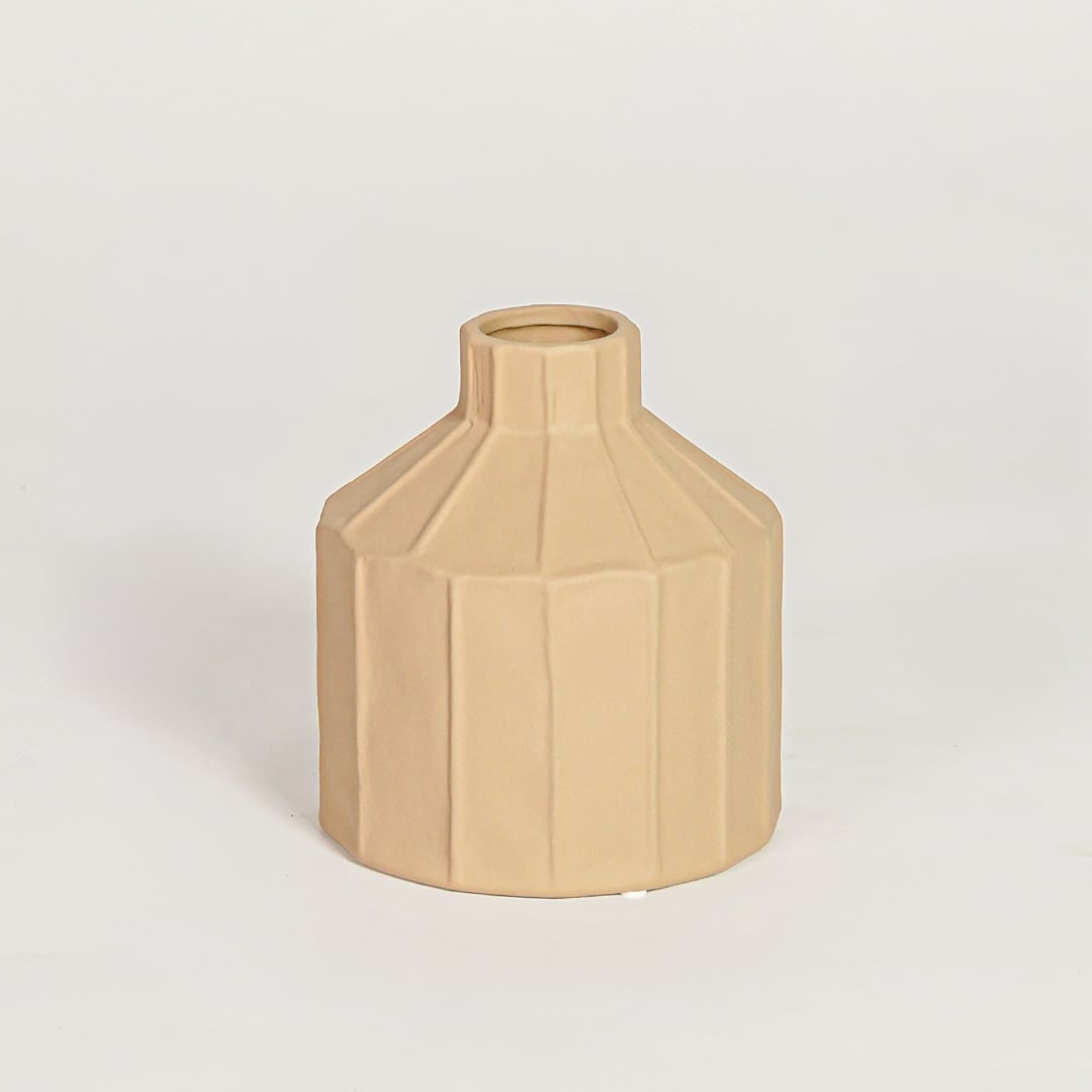 Contemporary beige ceramic flower vase with geometric silhouette perfect for entryway table living room decor display.