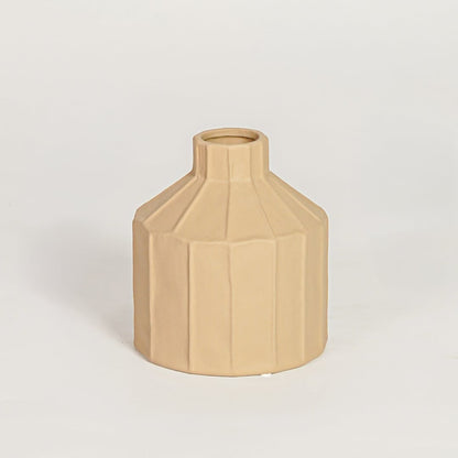 Contemporary beige ceramic flower vase with geometric silhouette perfect for entryway table living room decor display.