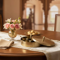 Gold metal serving tray lifestyle image with floral centerpiece for elegant luxury dining table decor.