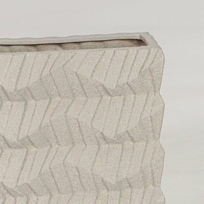 Beige ceramic decorative vase closeup with textured finish modern flower vase for shelf console styling.