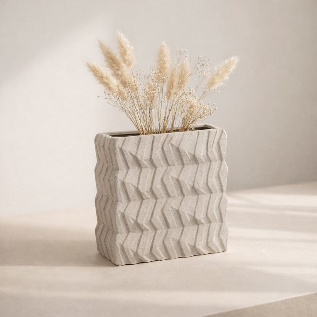 White ceramic flower vase with textured design placed on table modern decorative vase for living room styling.