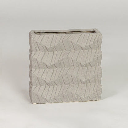 Beige ceramic decorative vase with textured finish modern flower vase for shelf console table decor styling.