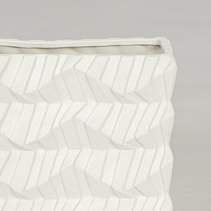 White ceramic decorative vase closeup with textured pattern modern flower vase for shelf console decor styling.