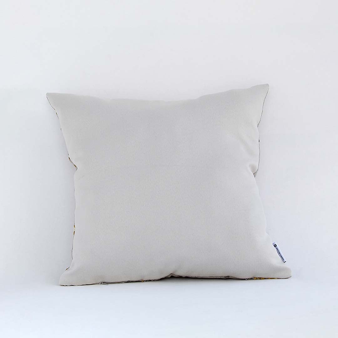 Back view of plain white cushion cover showing smooth fabric finish concealed stitching and clean minimal home decor look.