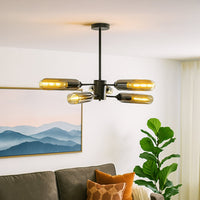 Black metal chandelier with smoky glass shades brightening modern living room interior for stylish contemporary ceiling decor.