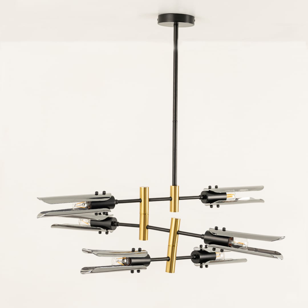 Black and gold chandelier displayed on white background with light off showing sleek design artistic balance and refined finish.