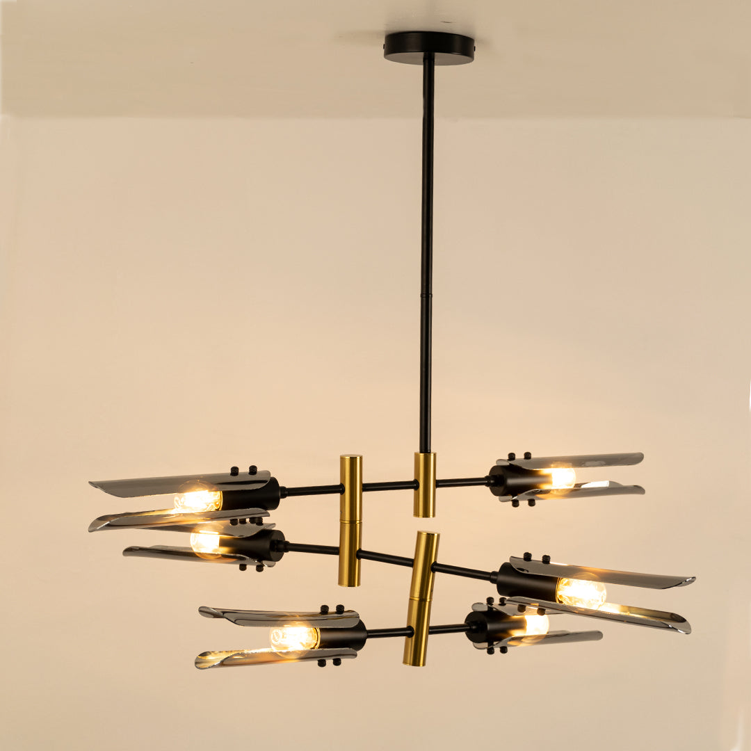 Black and gold metal chandelier with exposed bulbs designed for striking modern ceiling lighting in contemporary interiors.