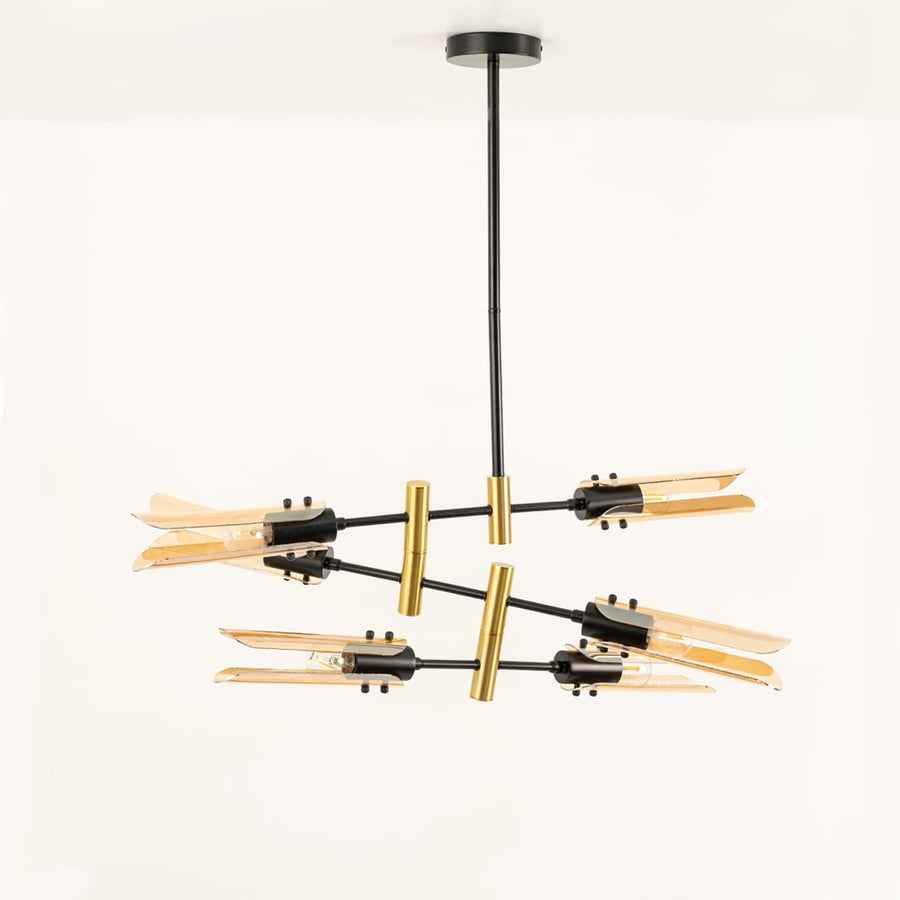 Black and gold chandelier displayed on white background with lights off showing artistic glass structure and premium metal finish.
