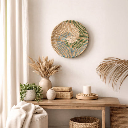 Natural spiral woven wall basket displayed above a console for elegant bohemian wall decor and contemporary home interiors.