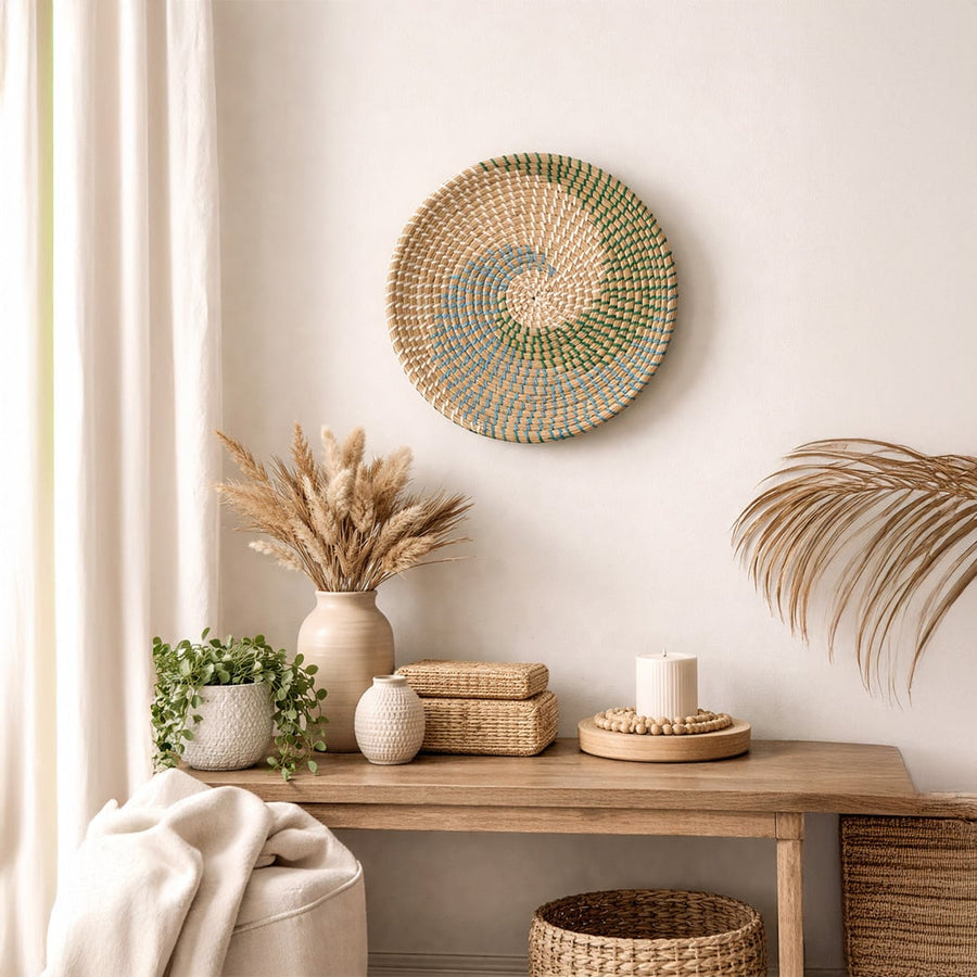 Natural spiral woven wall basket displayed above a console for elegant bohemian wall decor and contemporary home interiors.