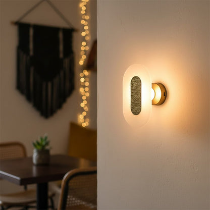 Modern gold textured wall light with warm ambient glow for stylish bedroom and premium decor spaces.


