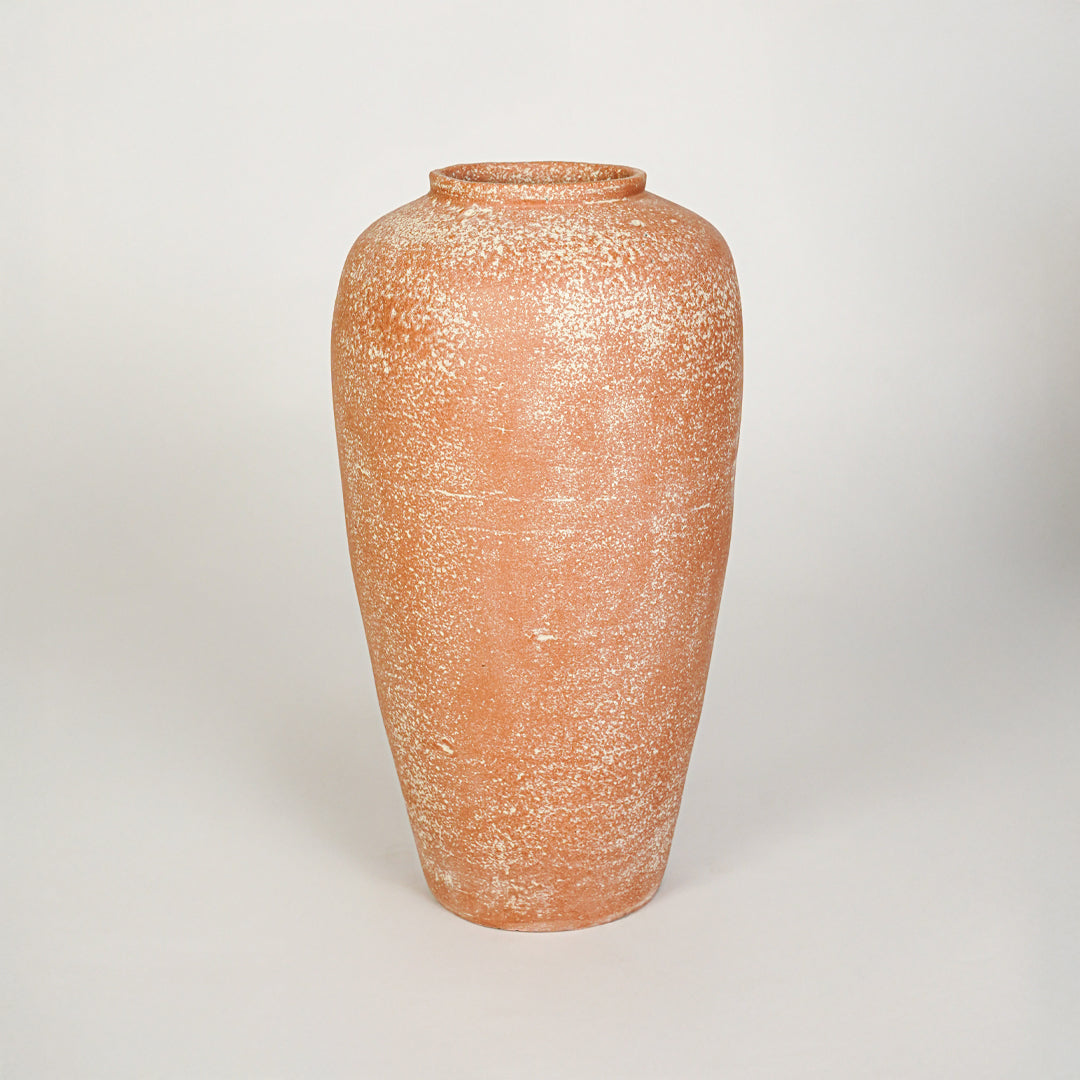 White background image of peach ceramic decorative vase for elegant floor placement with matte textured finish.
