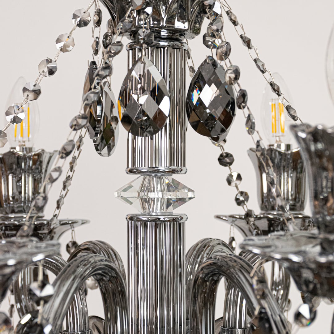 Closeup of black crystal chandelier with faceted crystal drops and curved arms perfect for luxury ceiling decor.