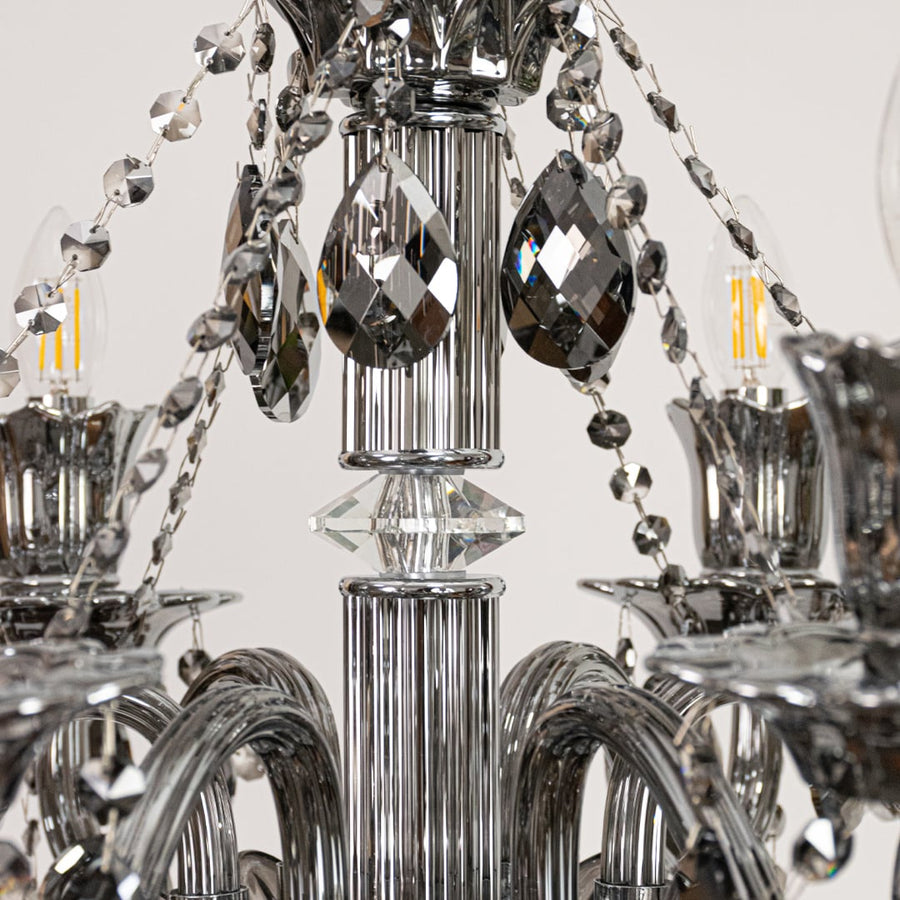 Closeup of black crystal chandelier with faceted crystal drops and curved arms perfect for luxury ceiling decor.