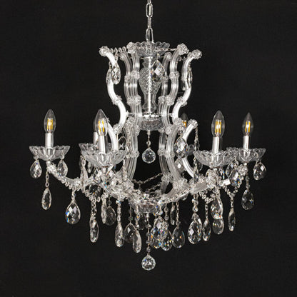Chrome crystal chandelier with intricate glass arms and droplets displayed on black background for a dramatic decor look.