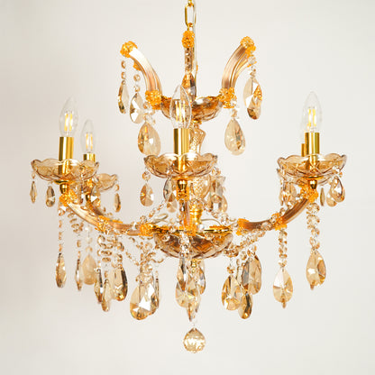 White background image of classic crystal chandelier for elegant dining room decor styling with unlit crystal arms.