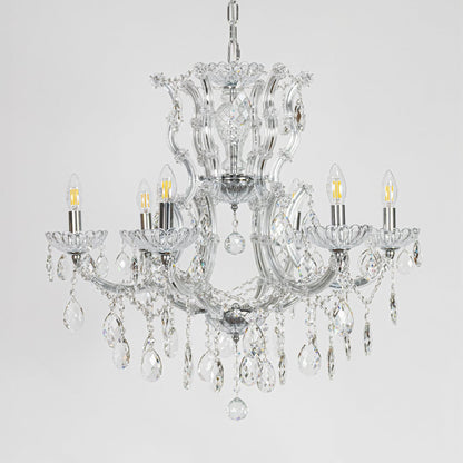 Chrome crystal chandelier with sculpted glass arms and drops shown on white background for elegant home decor inspiration.