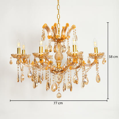 A gold-finished multi-light chandelier with clear glass teardrop crystals, shown against a plain white background with dimension lines indicating 77 cm width and 58 cm height.