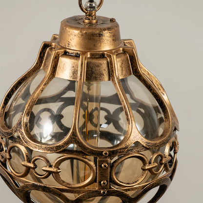 Close up view of the decorative metal rings and inner glass globe of the black spherical cage pendant light fixture.