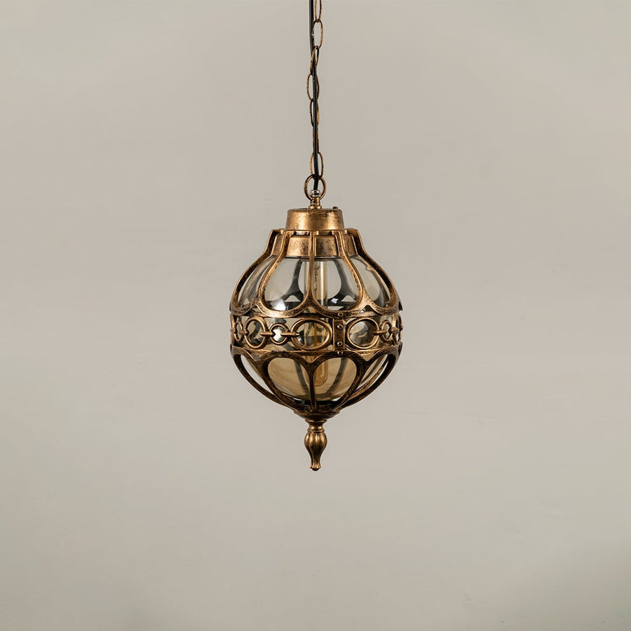 Unlit black metal globe hanging light fixture with decorative circular pattern cage isolated against a plain white background.