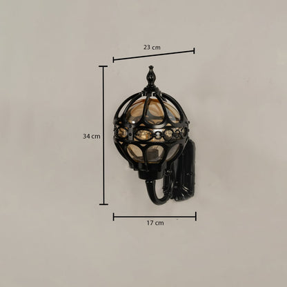 Black metal outdoor globe lantern wall light with dimensions 34 cm height 23 cm width and 17 cm depth shown clearly for accurate size reference.