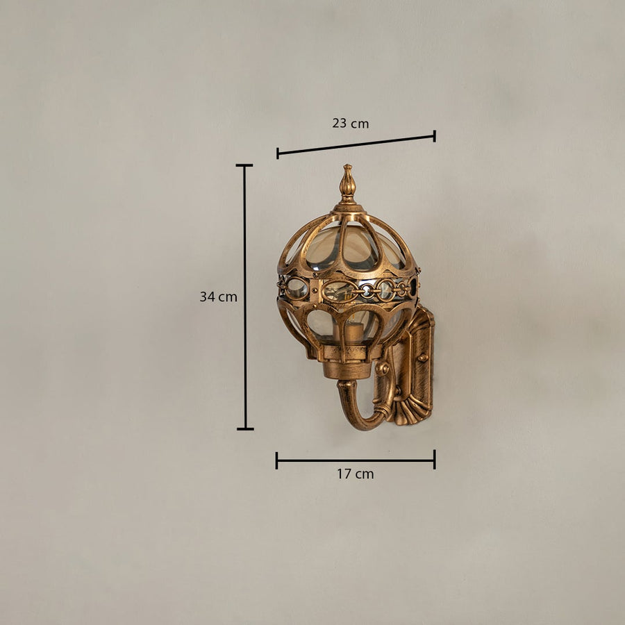 Gold metal dome outdoor wall lantern with glass panels showing size 34 cm height 23 cm width and 17 cm depth for accurate exterior fitting.