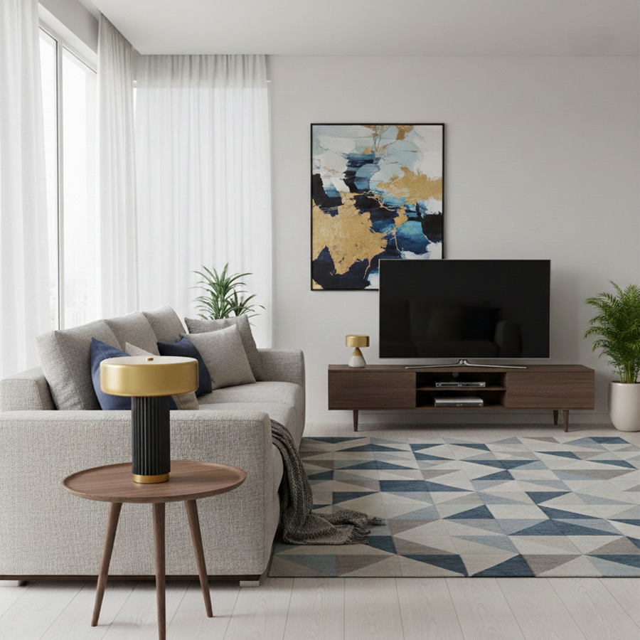 Table lamp styled on wooden side table beside modern sofa creating warm ambient lighting with gold shade and black ribbed base for cozy living rooms.