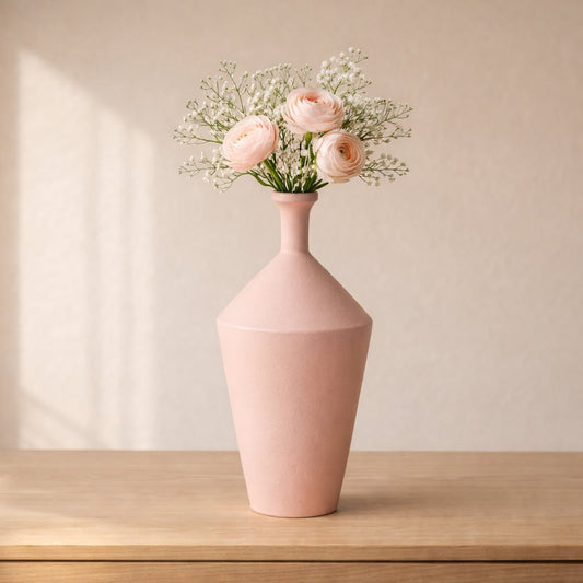 Pink ceramic flower vase placed on wooden table with flowers modern decorative vase for living room home decor styling.