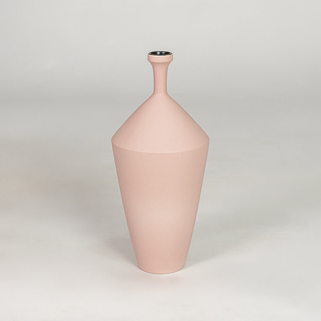Tall slender matte pastel pink vase for chic modern home decor and refined elegant tabletop accent styling needs.