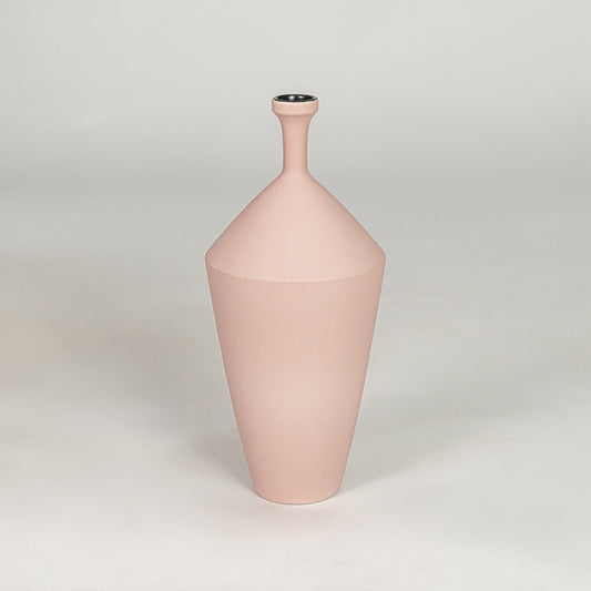 Tall slender matte pastel pink vase for chic modern home decor and refined elegant tabletop accent styling needs.