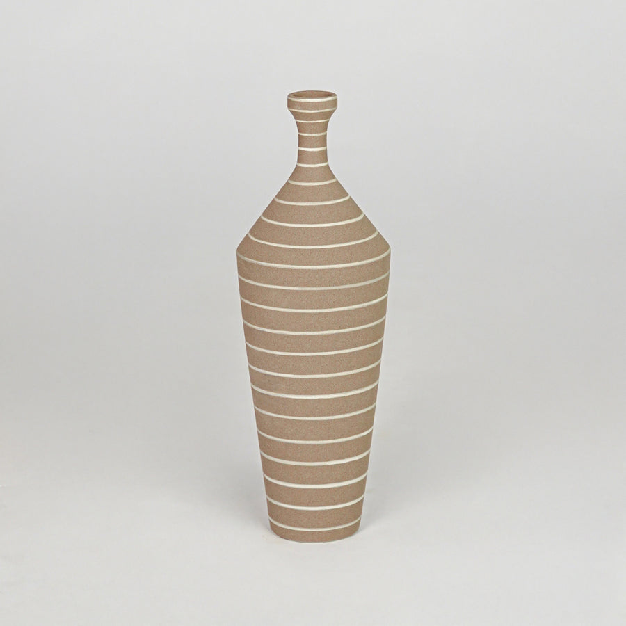Textured brown and white striped tapered vase for artistic modern home decor and elegant minimalist display style.