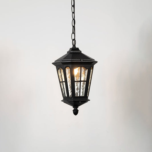 Hanging lantern light on white background showcasing classic outdoor wall lighting fixture with glass panels and black metal frame.