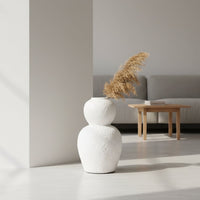 White textured decorative vase styled in a modern room setting adding artistic sculptural decor to living rooms hallways and contemporary interiors.
