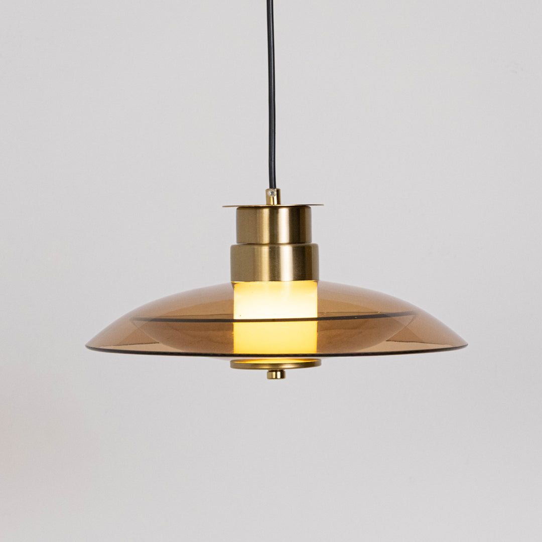 Minimal pendant light in gold metal finish with dome shade for kitchen island or dining decor lighting white background.