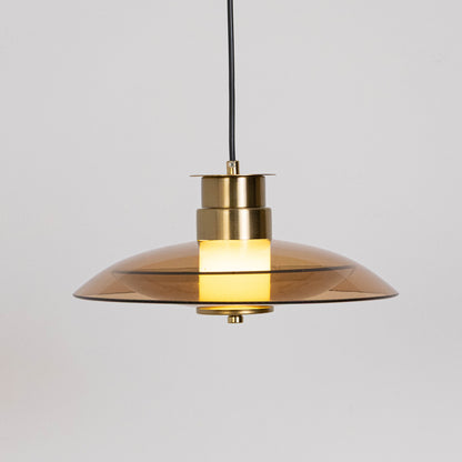 Minimal pendant light in gold metal finish with dome shade for kitchen island or dining decor lighting white background.