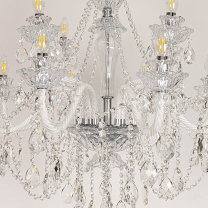 Closeup of large clear crystal chandelier with detailed crystal droplets and curved arms perfect for luxury ceiling decor.