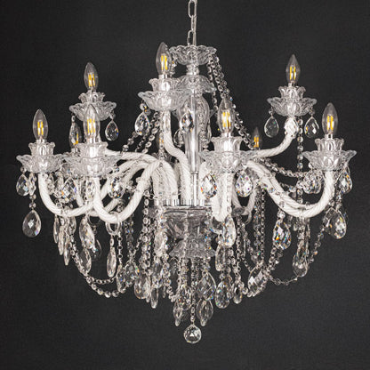 Large clear crystal chandelier shown on black background highlighting premium crystal detailing for elegant ceilings.