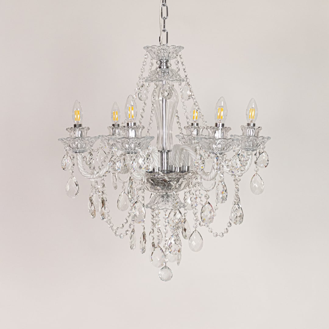 Clear crystal chandelier displayed on white background ideal for classic bright interior ceiling styling.