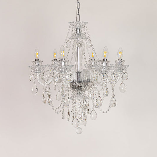 Clear crystal chandelier displayed on white background ideal for classic bright interior ceiling styling.