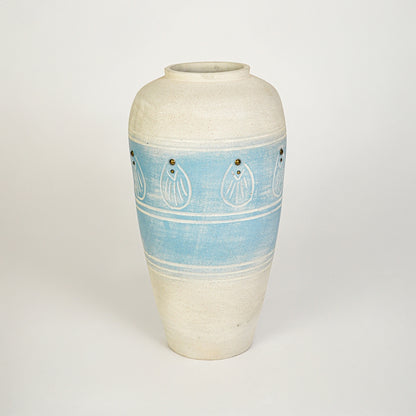 White background image of blue ceramic decorative vase for elegant floor placement with artistic textured finish.