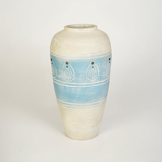 White background image of blue ceramic decorative vase for elegant floor placement with artistic textured finish.